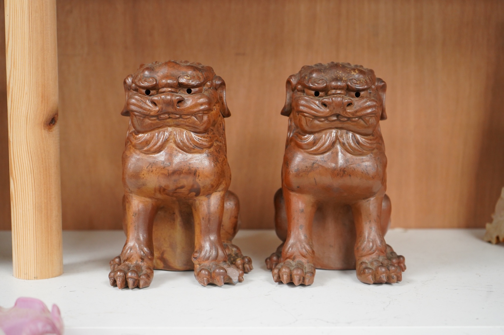 A pair of Japanese Bizan ware lion dogs (shi shi), 18cm high